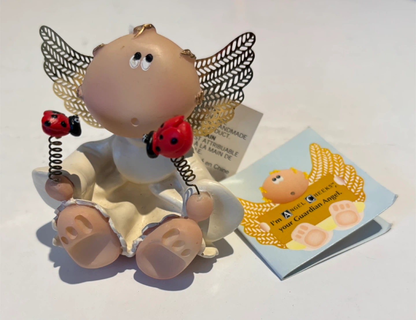 Russ Angel Cheeks figurine with ladybugs