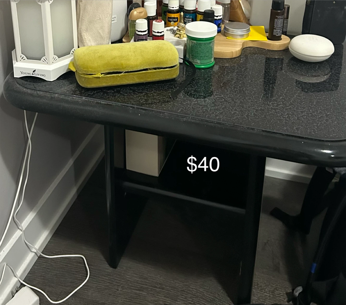 Black speckled side table with granite-look top