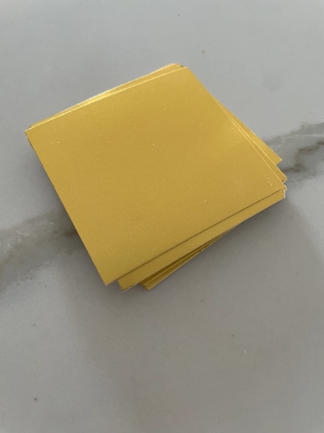 Stack of Gold Square Cards