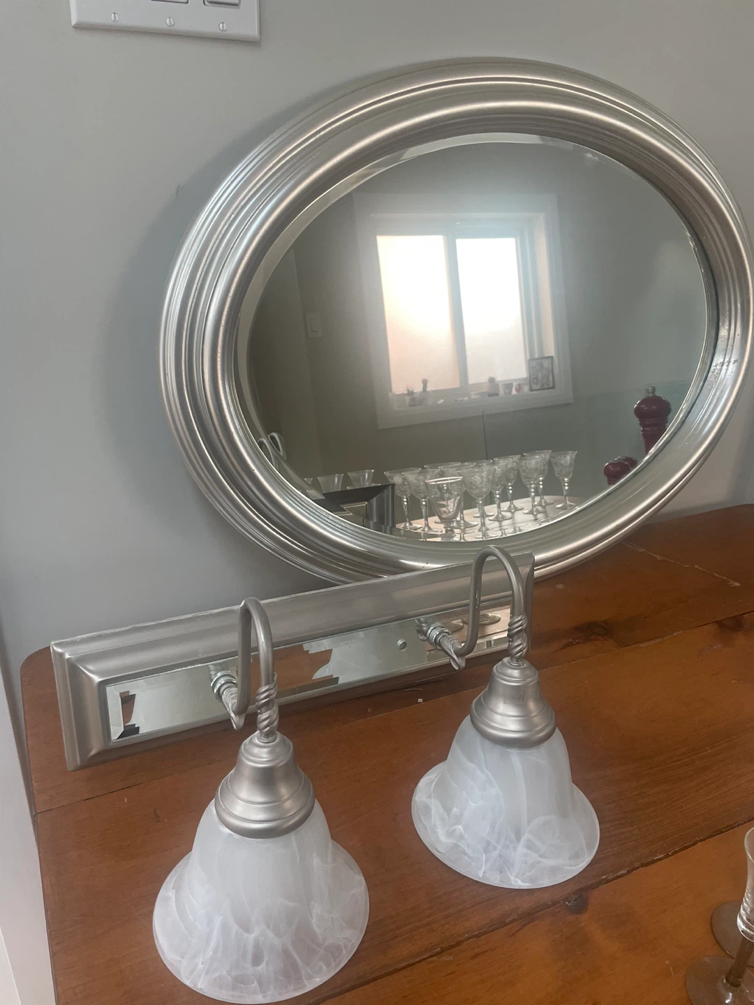 Silver Oval Mirror with Brushed Nickel Vanity Light Fixture