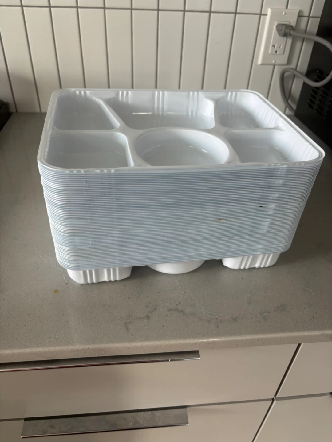 Stack of 6-Compartment White Plastic food dinner plates