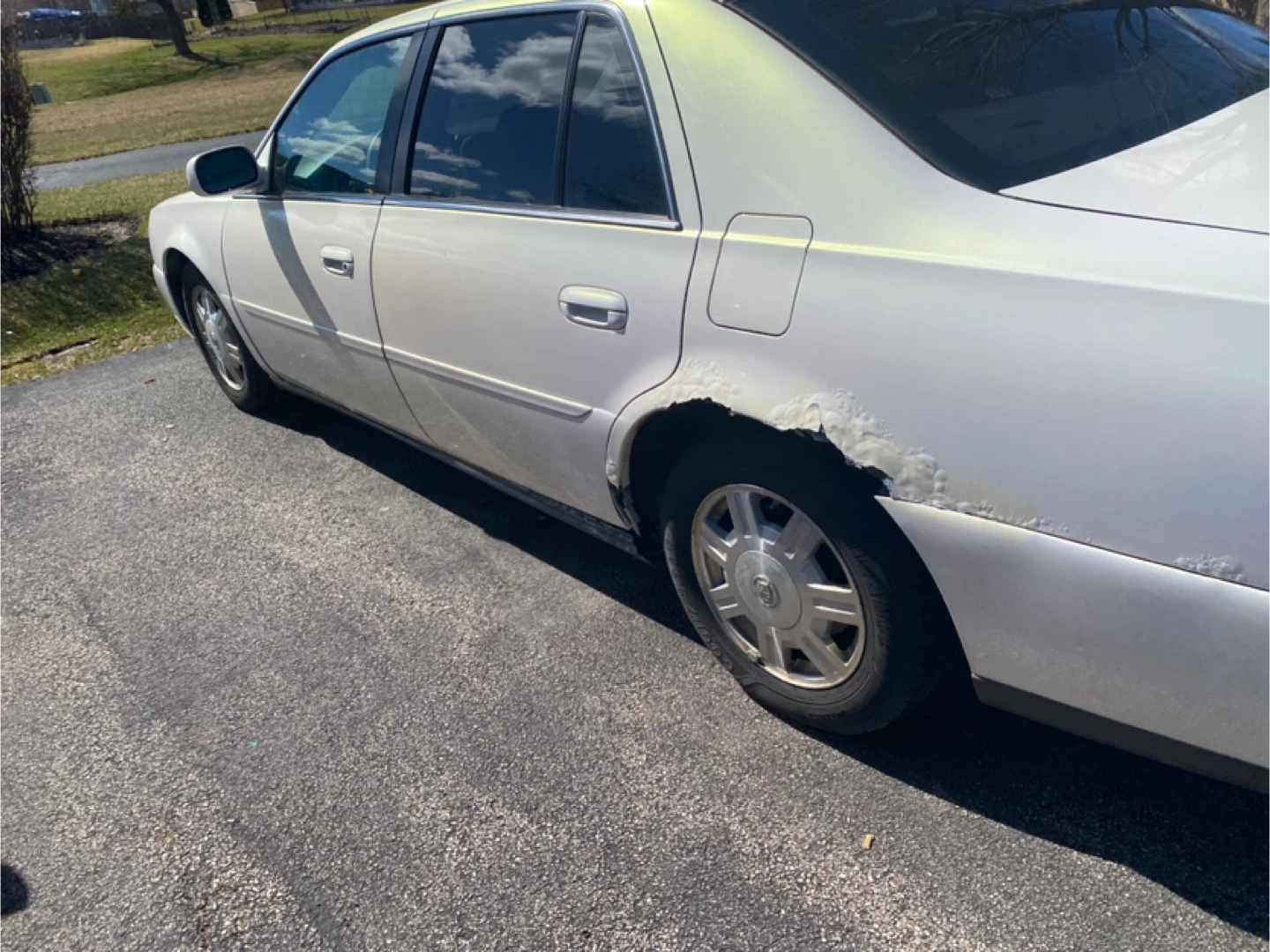 White Cadillac Sedan - Shows Rust