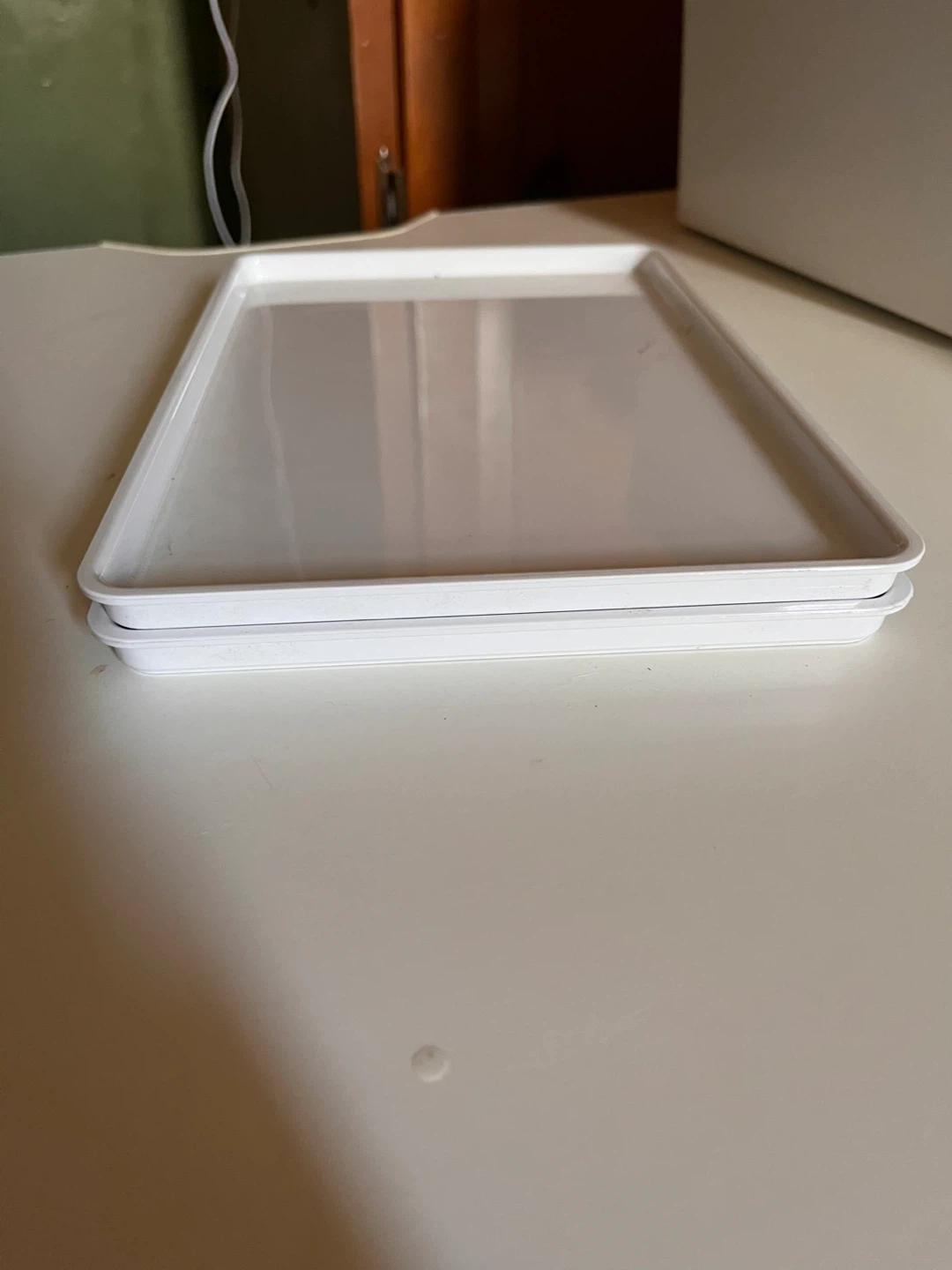 Stack of 2 White Plastic Trays