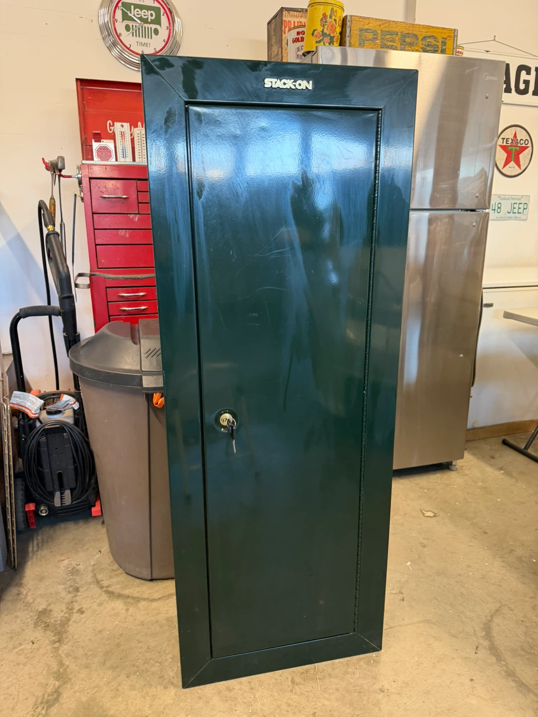 Stack-On Green metal cabinet.