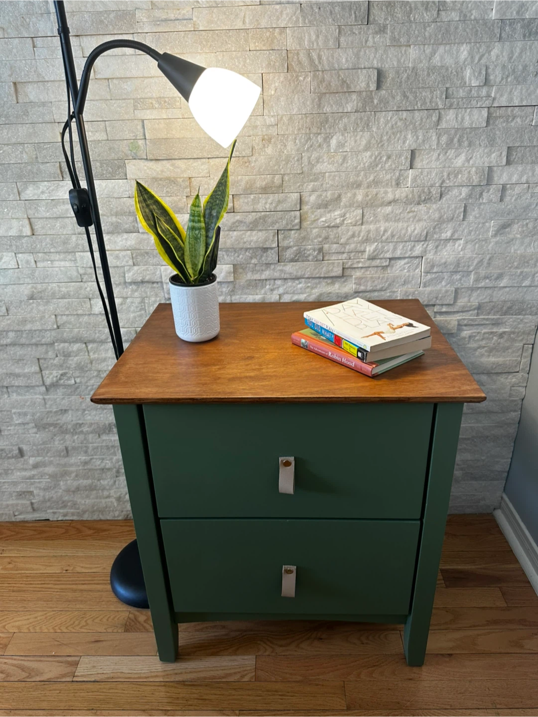 Green two-drawer nightstand with wood top