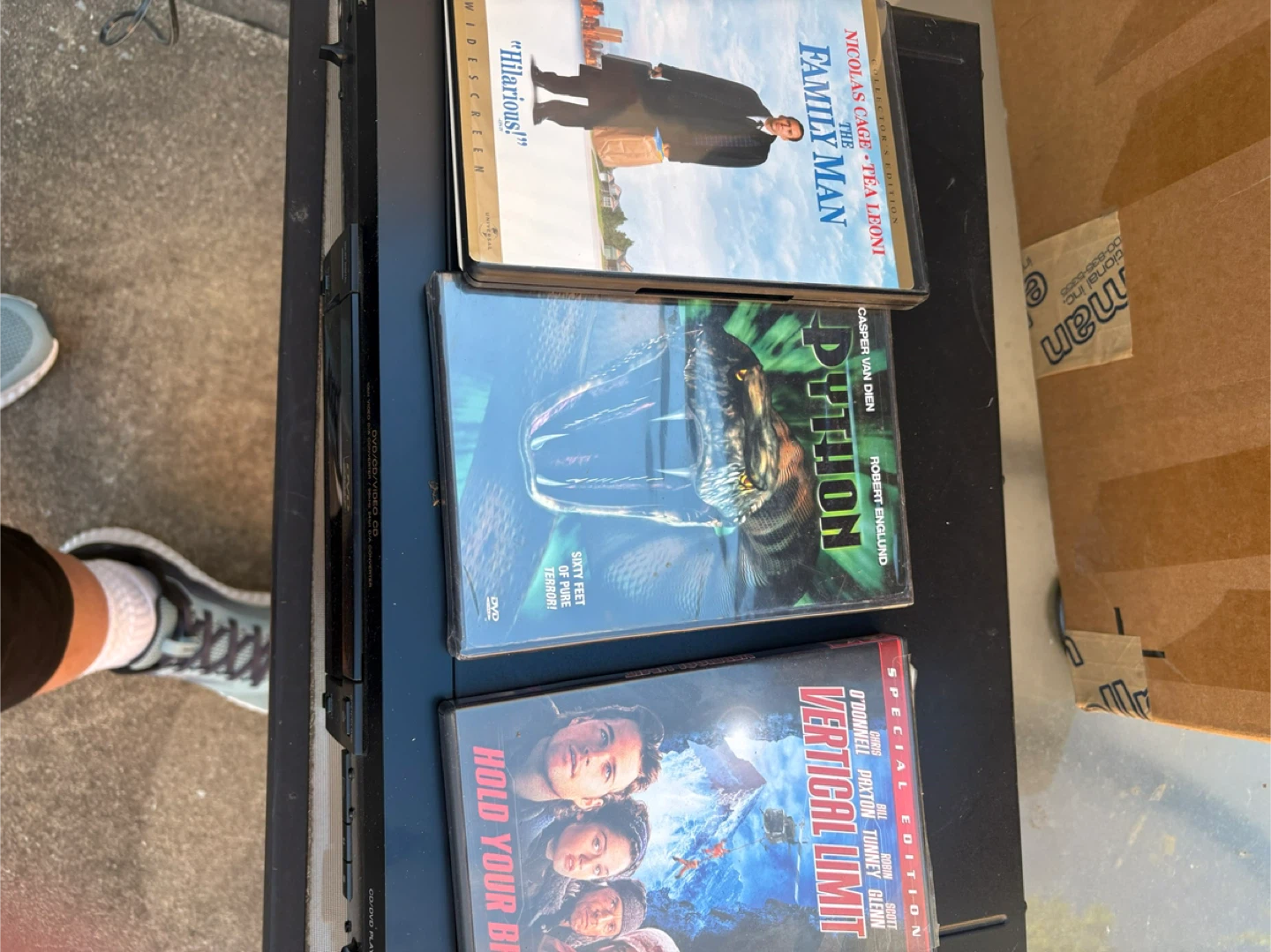 The Family Man, Python, and Vertical Limit DVDs