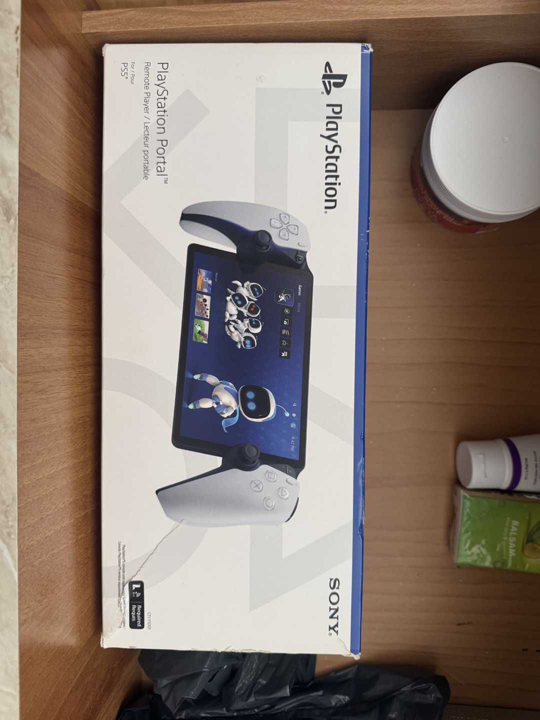 PlayStation Portal Remote Player PS5and headphones