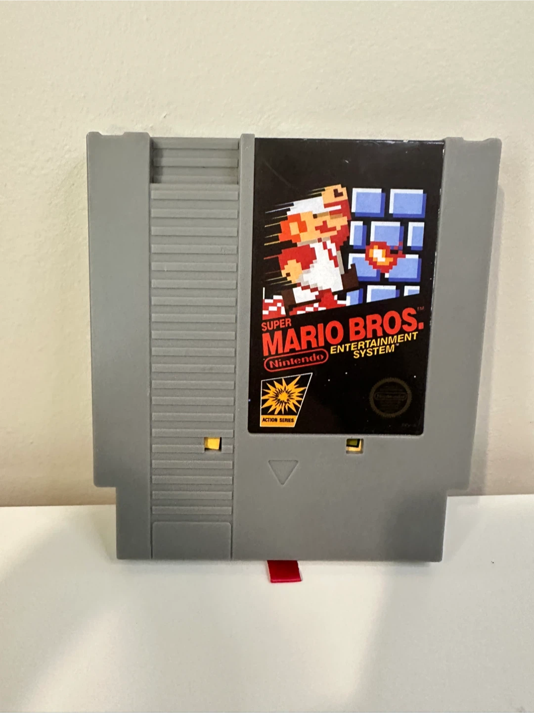 Super Mario Bros. NES Game Cartridge like with Pixel Art Figure