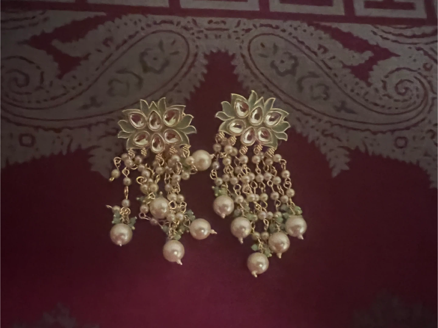 Gold coloured floral drop earrings with pearls