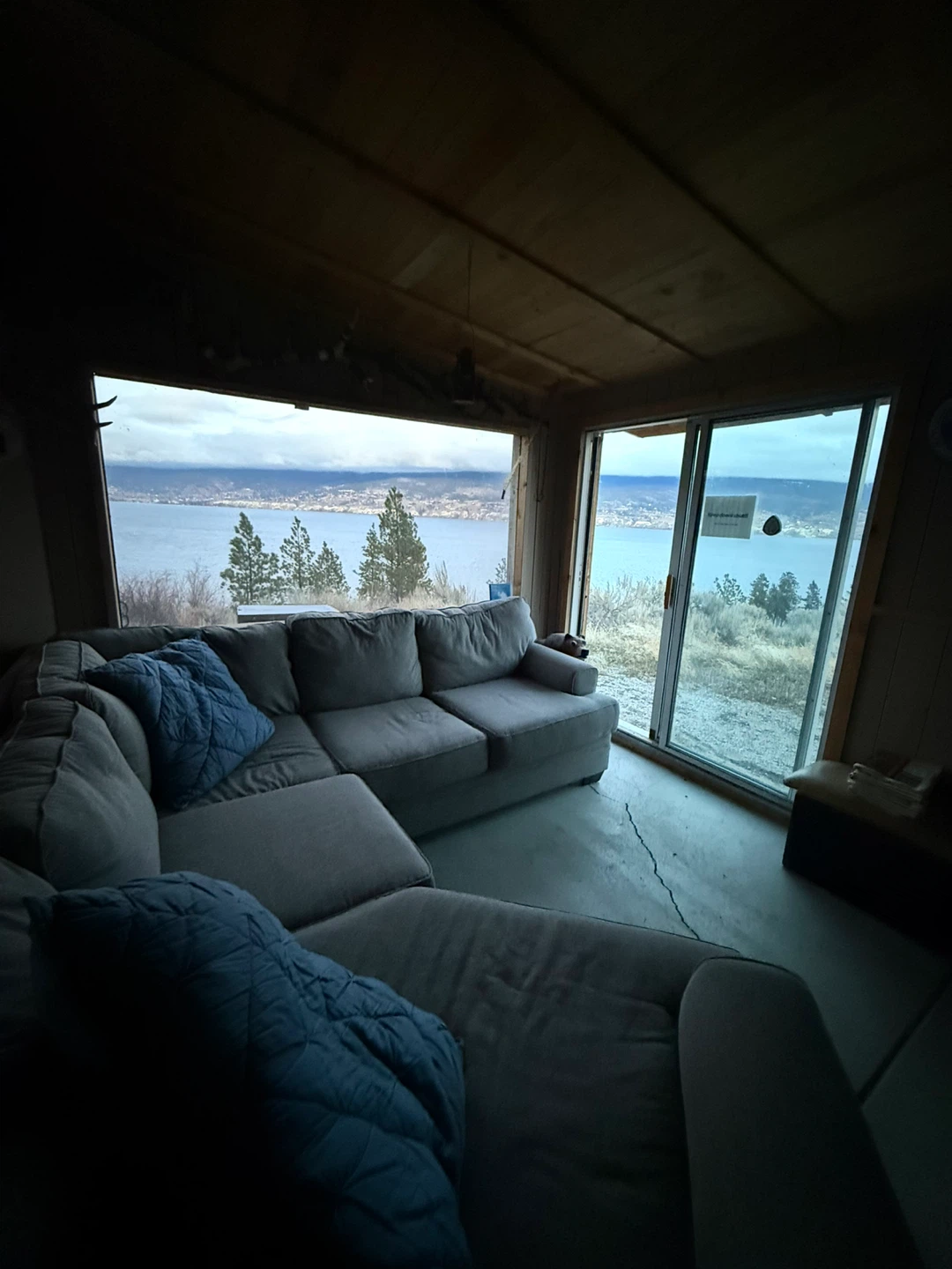 Grey Sectional Couch with Blue Accent Pillows