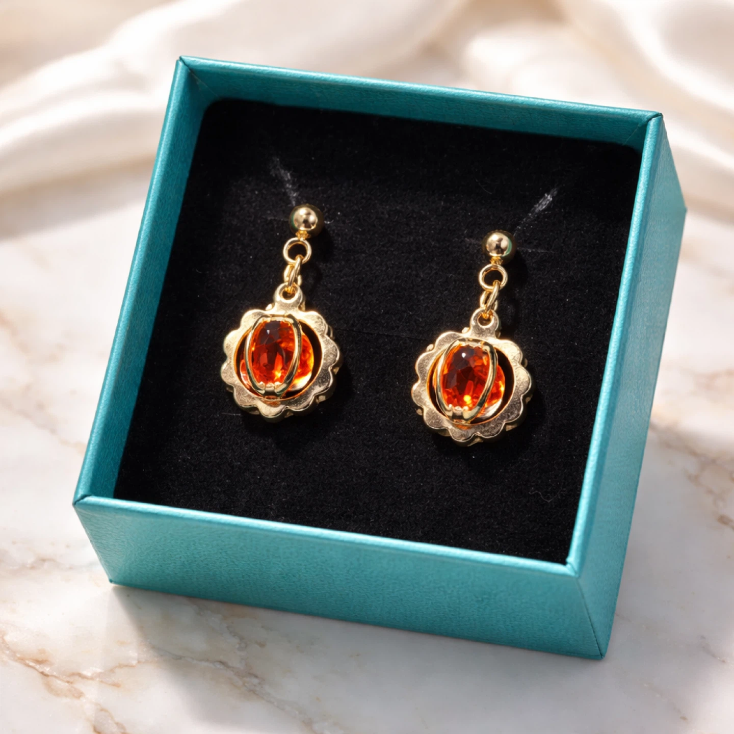 Gold Tone Flower Dangle Earrings with Blue Gemstones