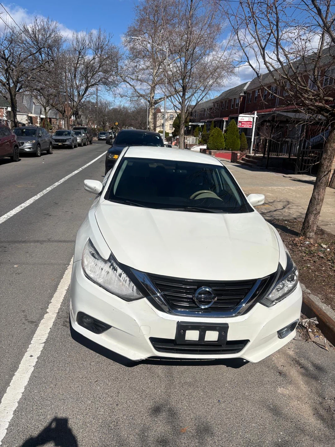 White Nissan Altima Sedan