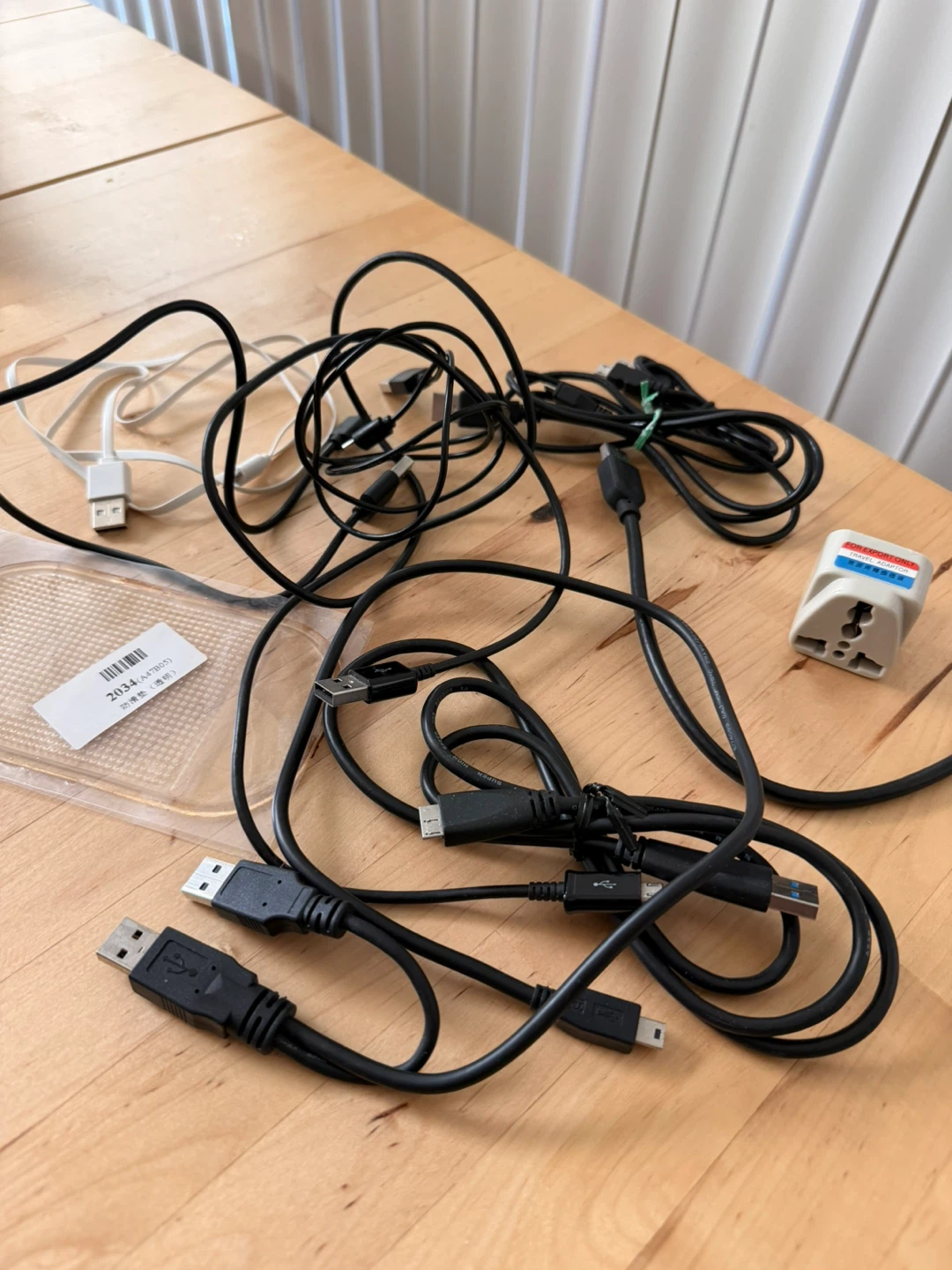 Assorted USB Cables and Travel Adapter