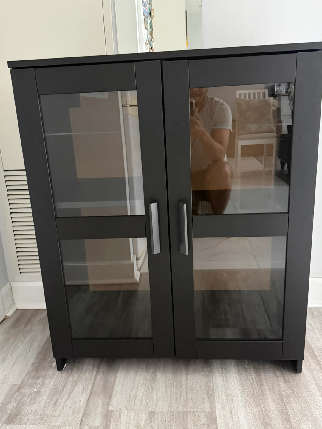 Black display cabinet with glass doors