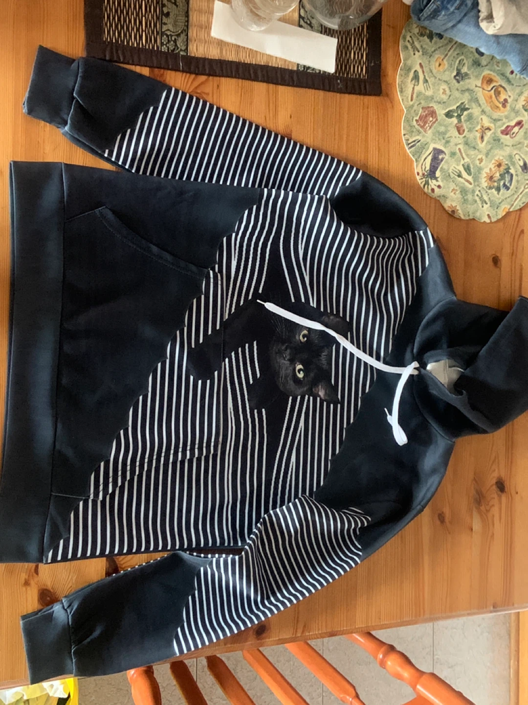 Black hoodie with graphic cat print