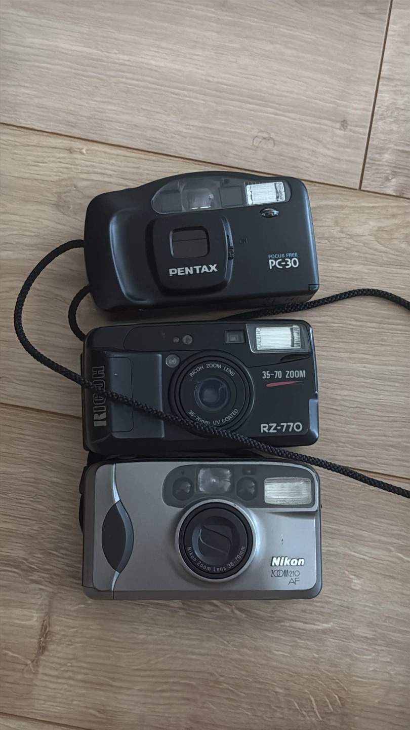 Pentax PC-30, Ricoh RZ-770, and Nikon Zoom 210 AF Cameras
