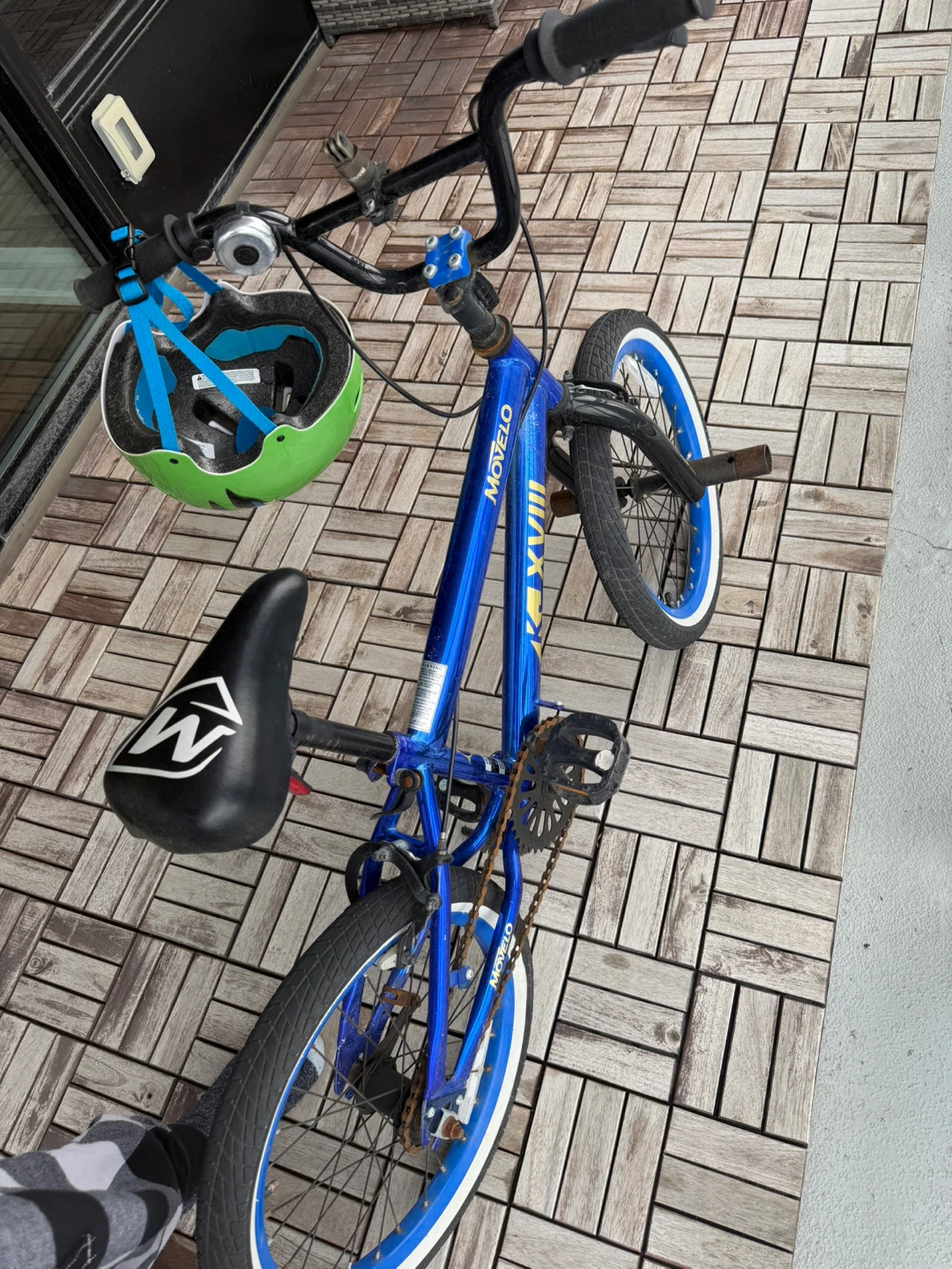 Blue Movelo BMX Bike with Green Helmet