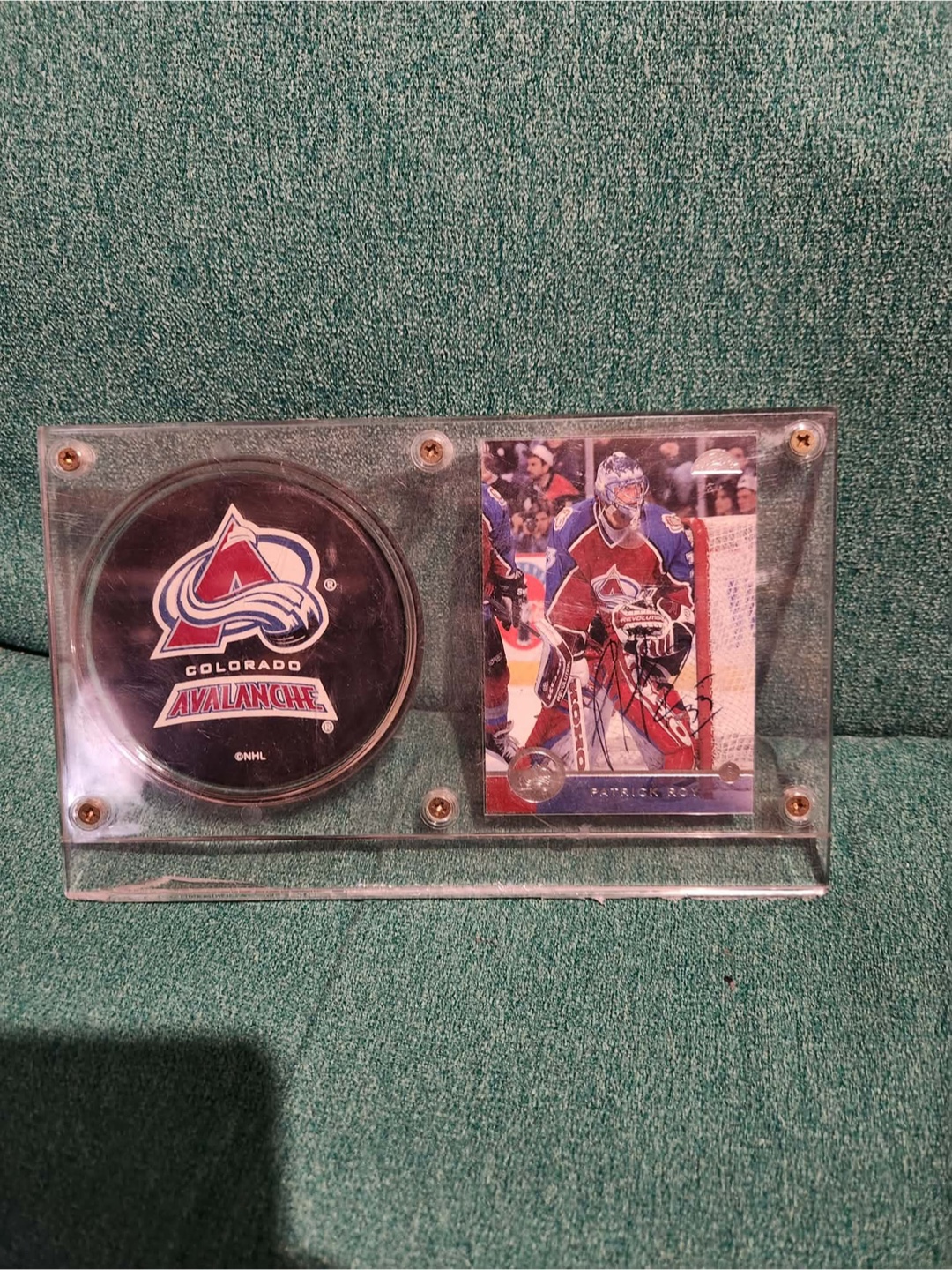 Signed Patrick Roy hockey card with commemorative puck