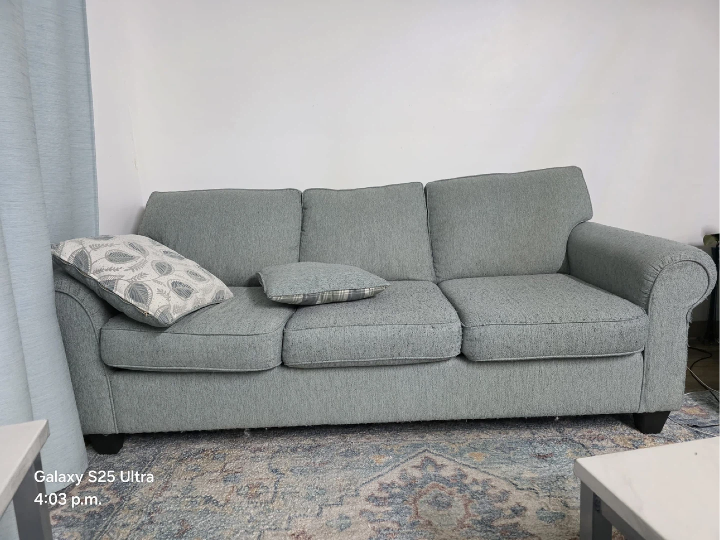 2 blue couchs and a set of curtains and 1 rug for FREE