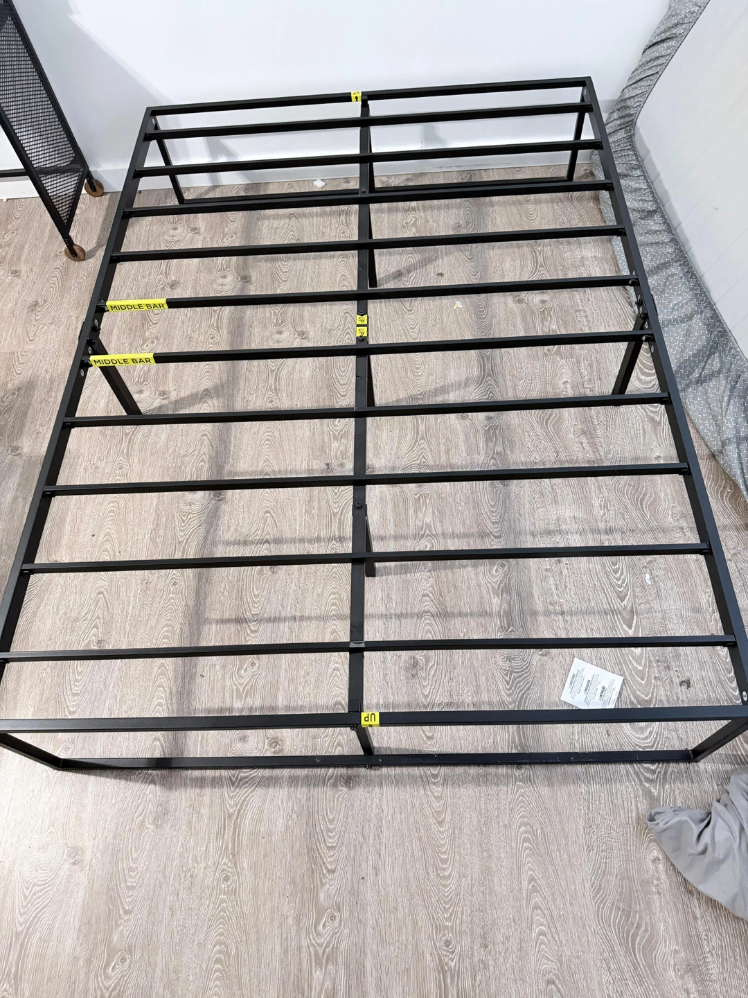 Full-size mattress and sturdy black metal frame for free!
