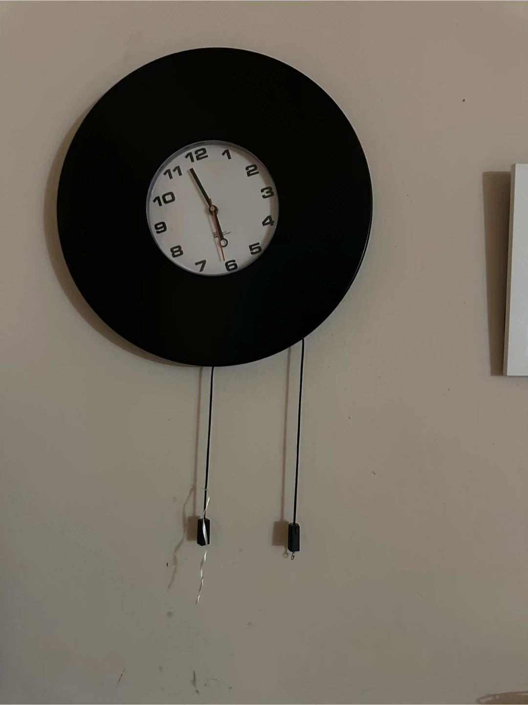 Black Wall Clock with Pendulum