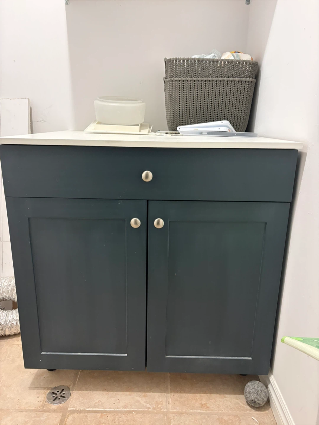 Dark Green Cabinet with White Countertop