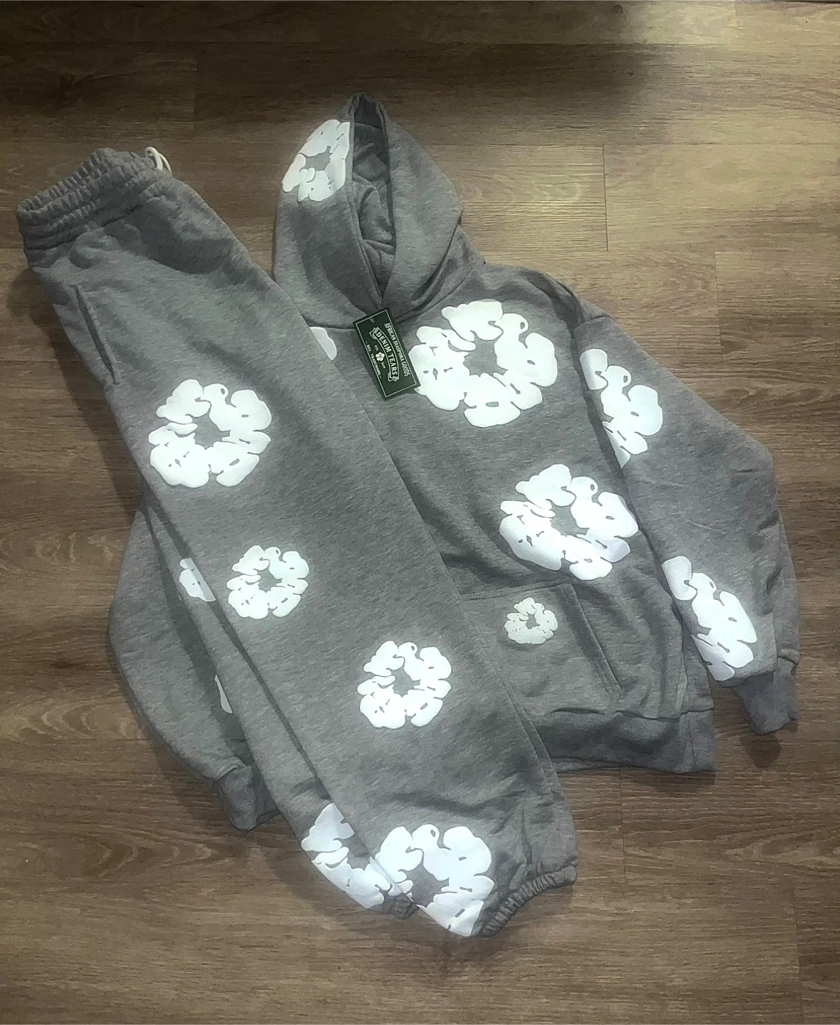 Grey & white denim tears hoodie and pants set.