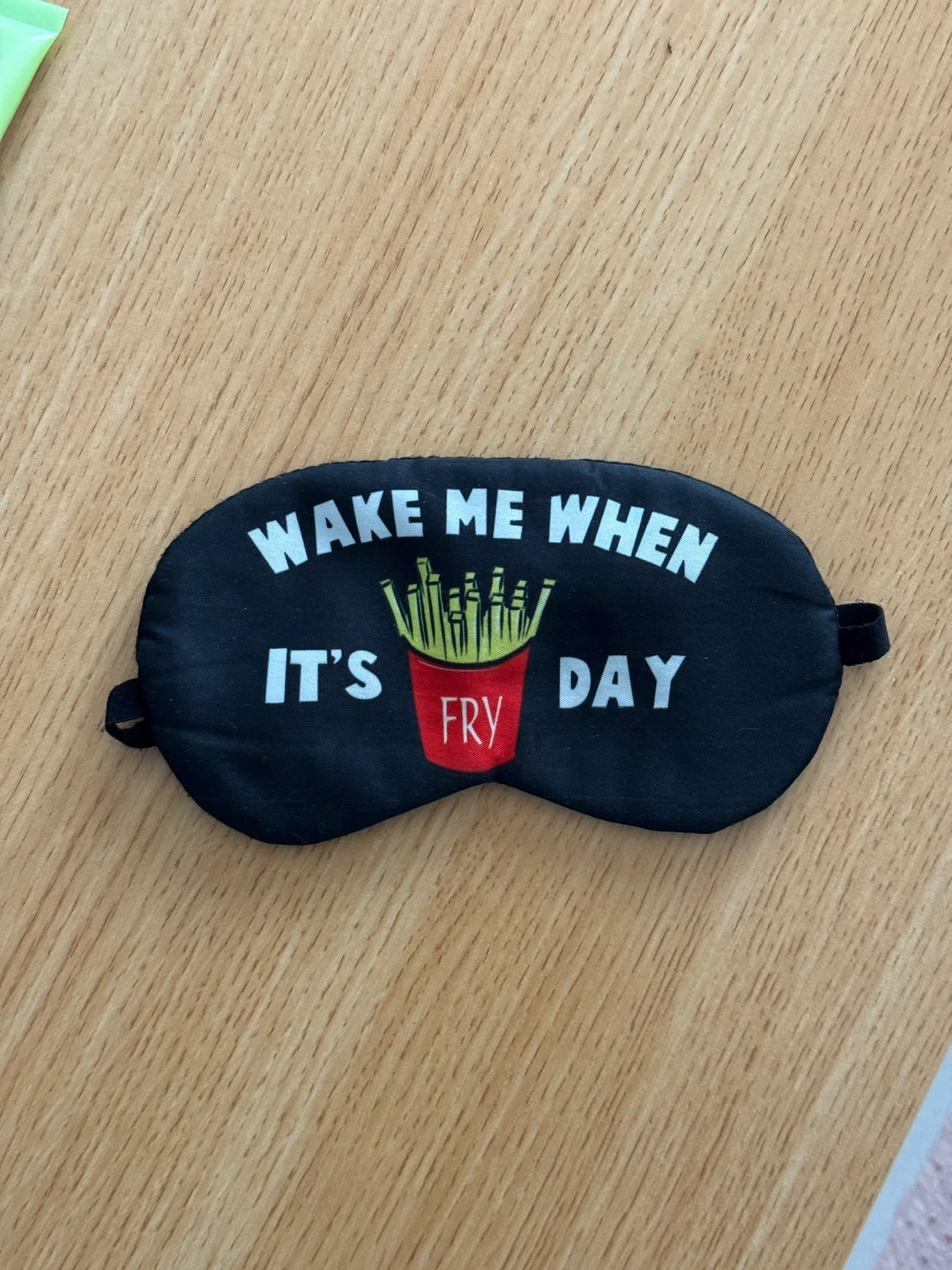 Black Sleep Mask with "Wake Me When It's Fry Day" Graphic