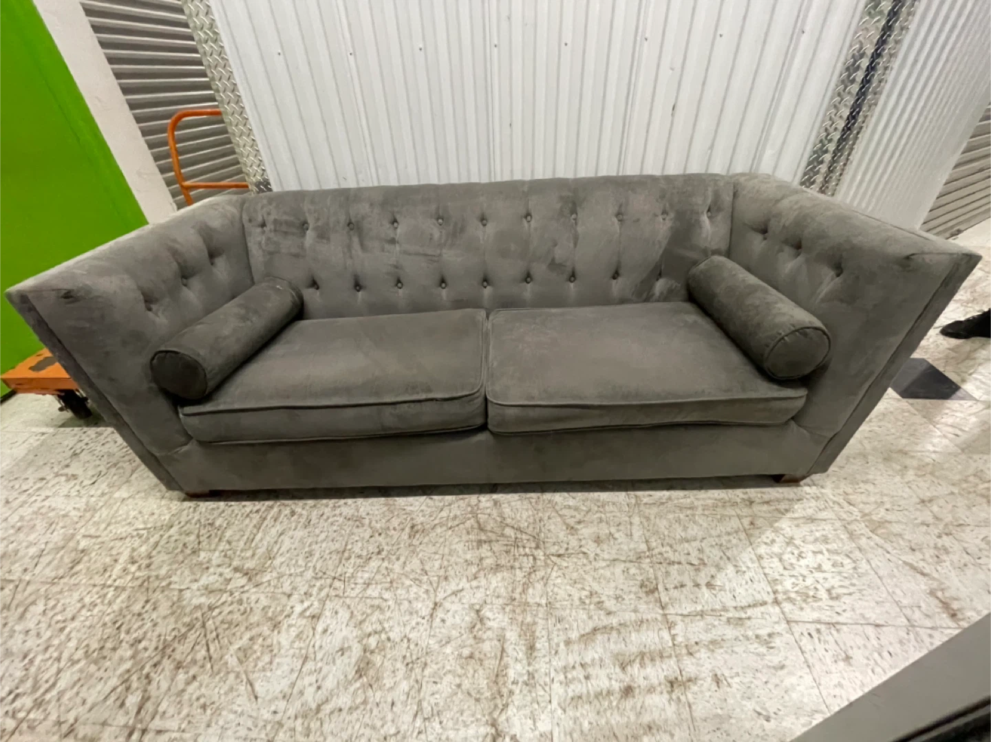 Gray Tufted Sofa with Bolster Pillows