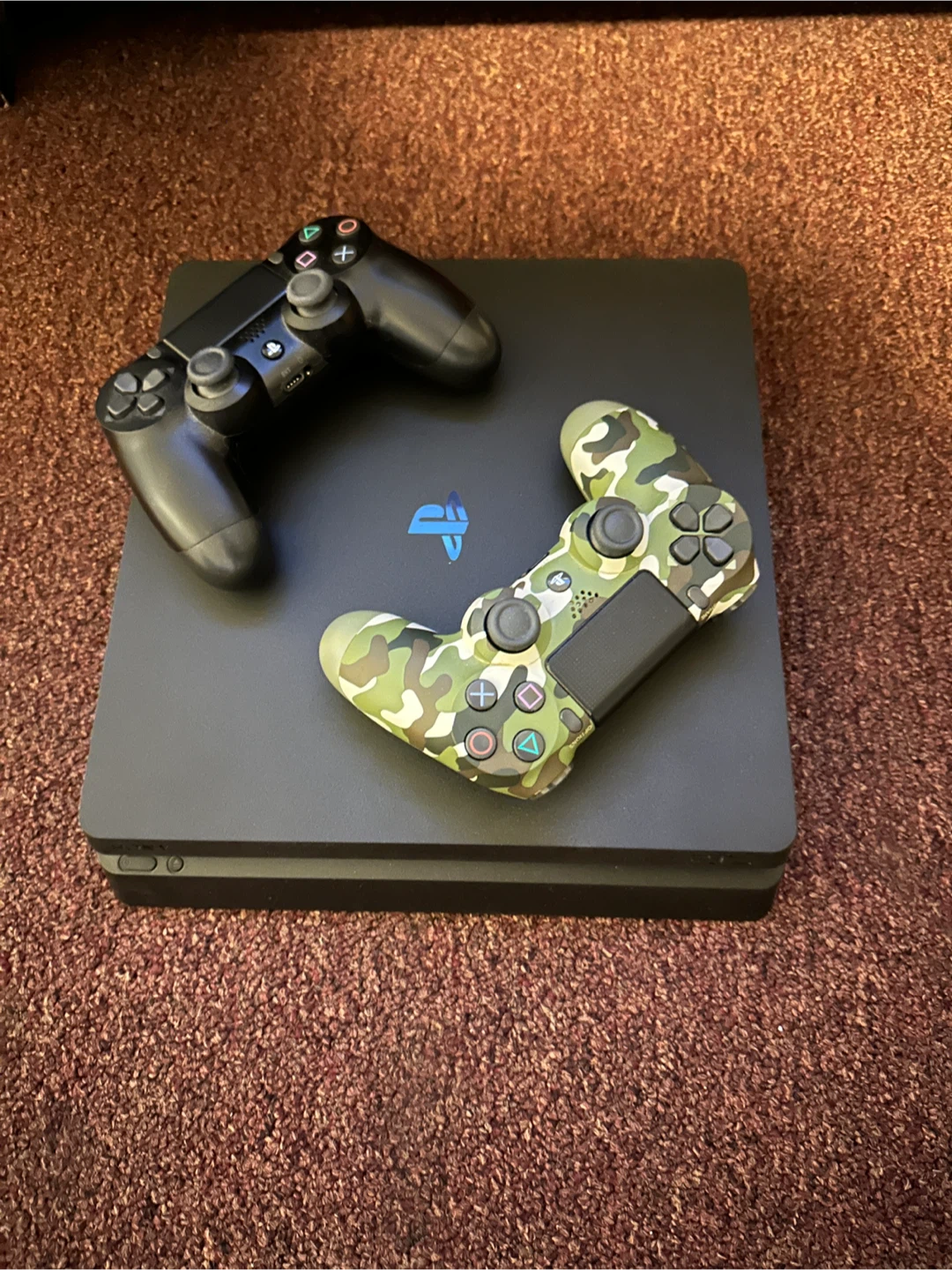 PlayStation 4 Slim Console with Two Controllers