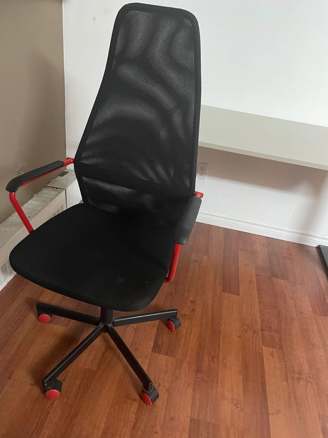 Black office chair with red accents