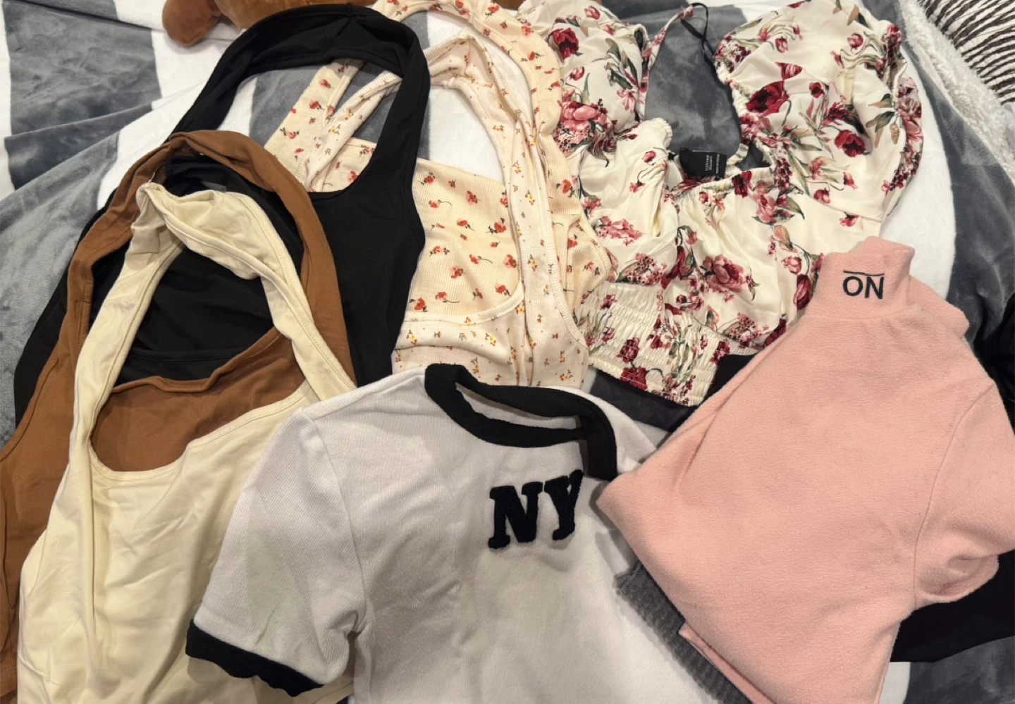 Assorted women's tops - floral, graphic, and solid colours