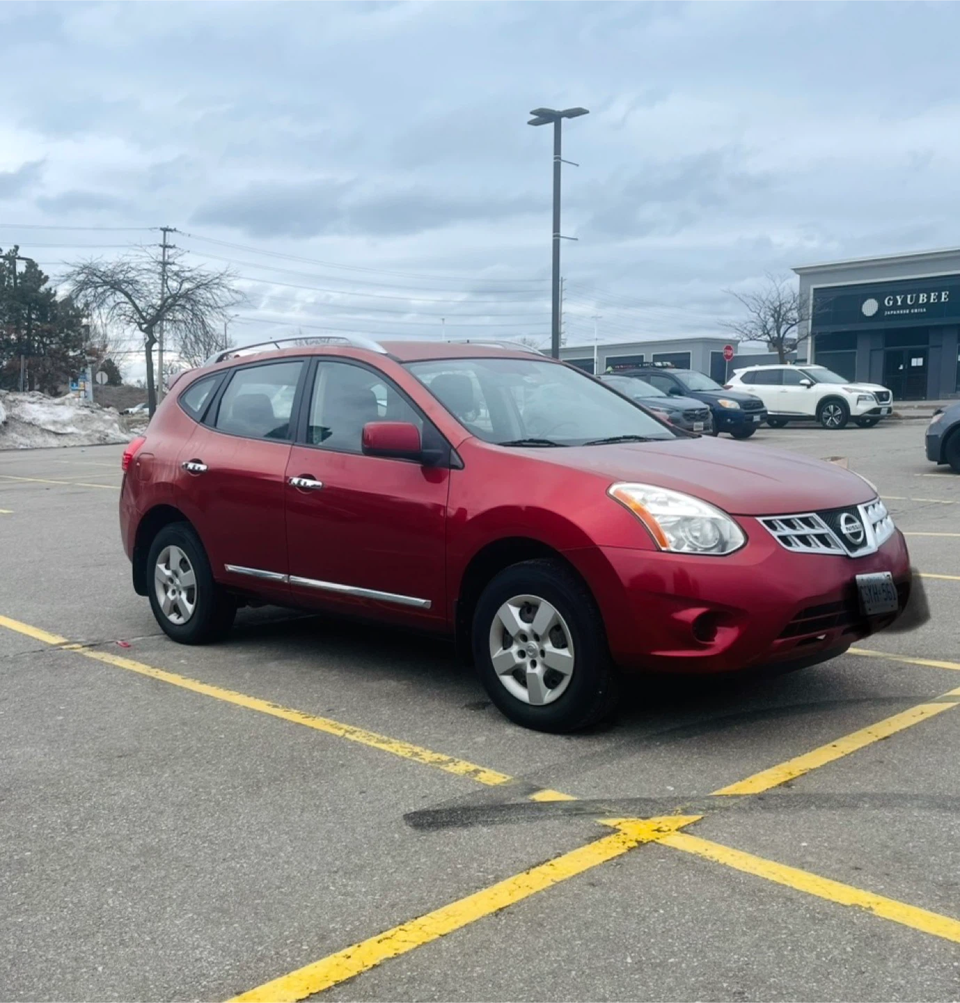 Red Nissan Rogue AWD