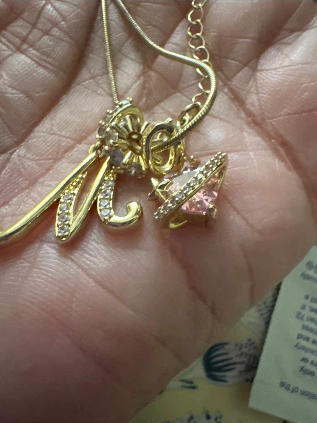 Gold Tone 'M' Pendant Necklace with Pink Charm