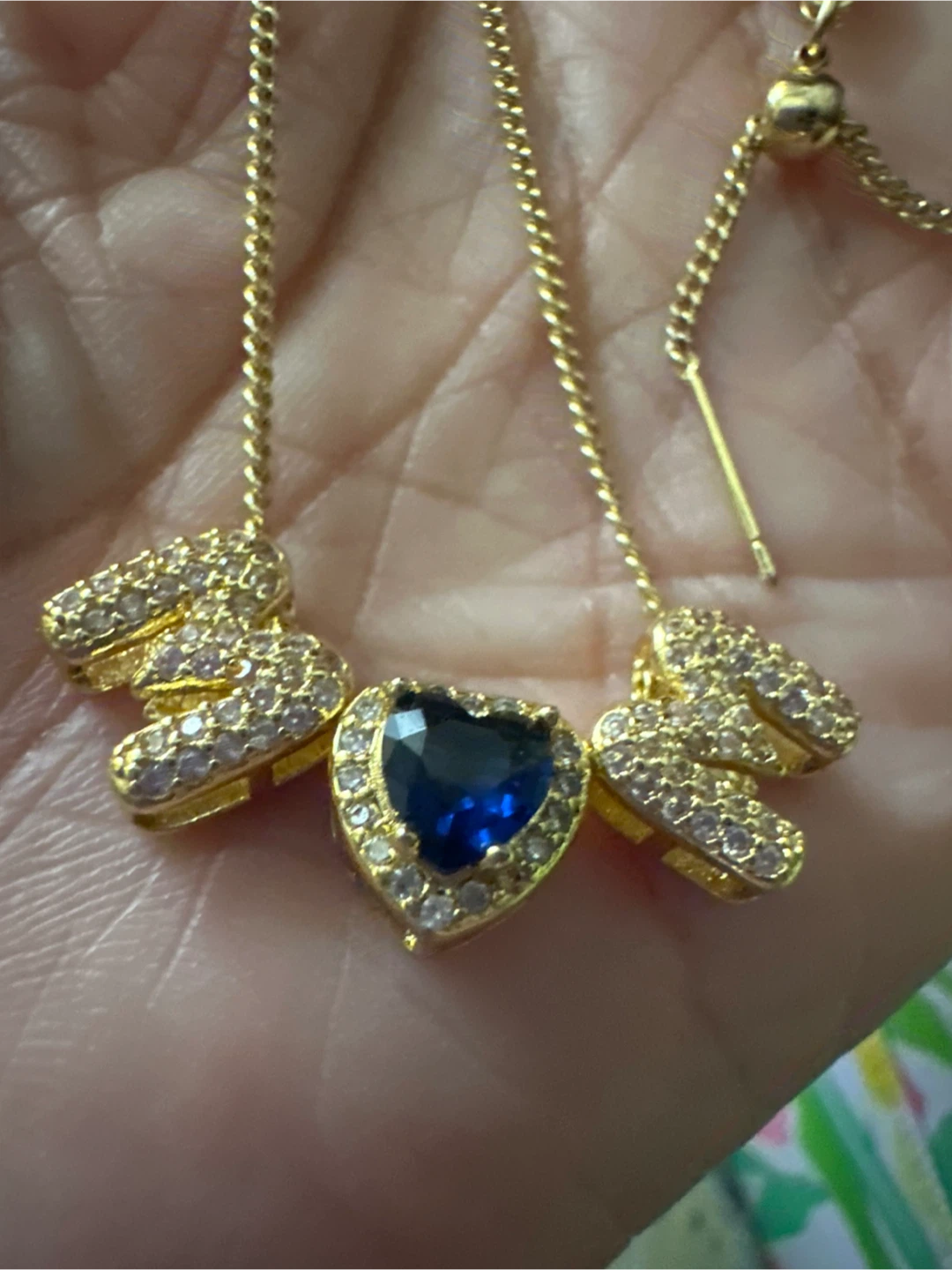 Gold Necklace with Blue Heart Pendant and Crystal Accents