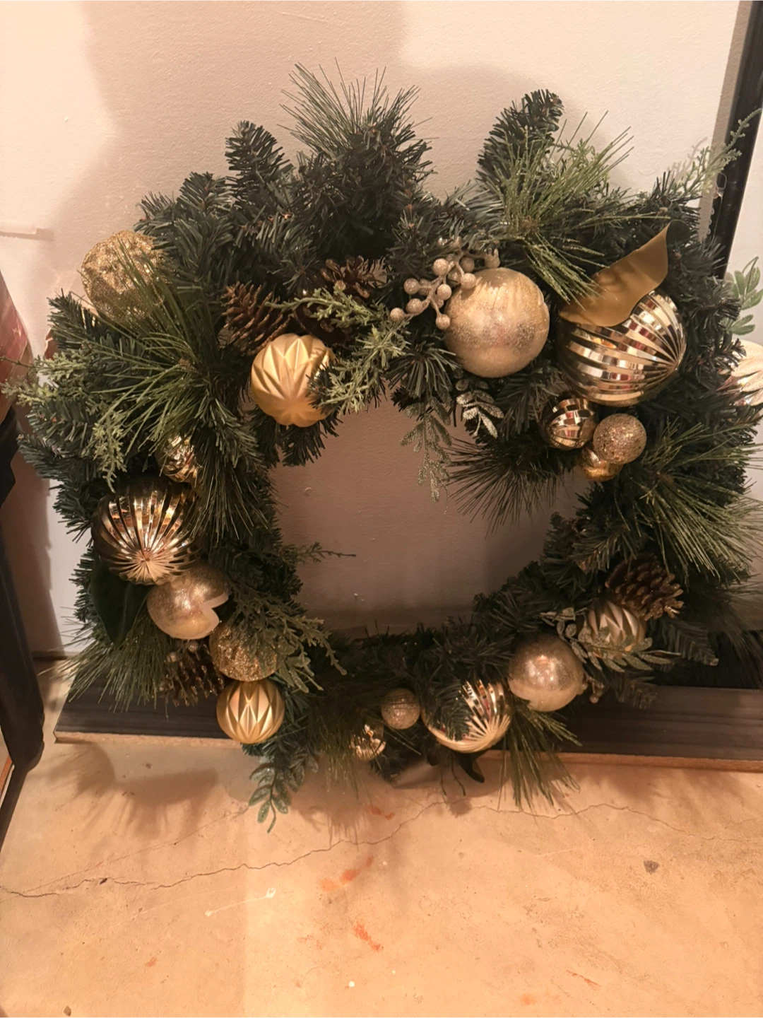 Christmas Wreath with Gold Ornaments and Pinecones