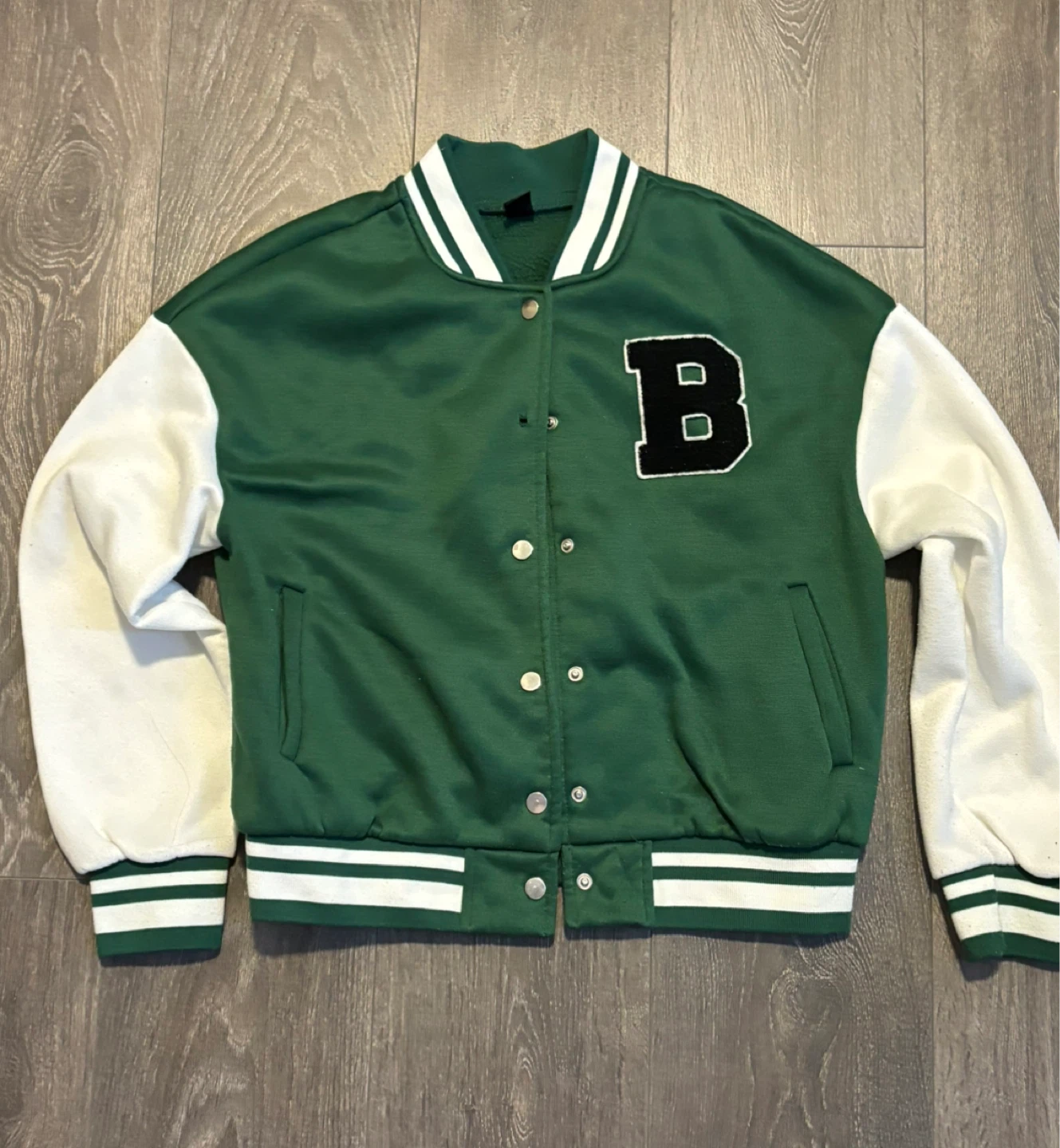 green and white varsity style bomber jacket