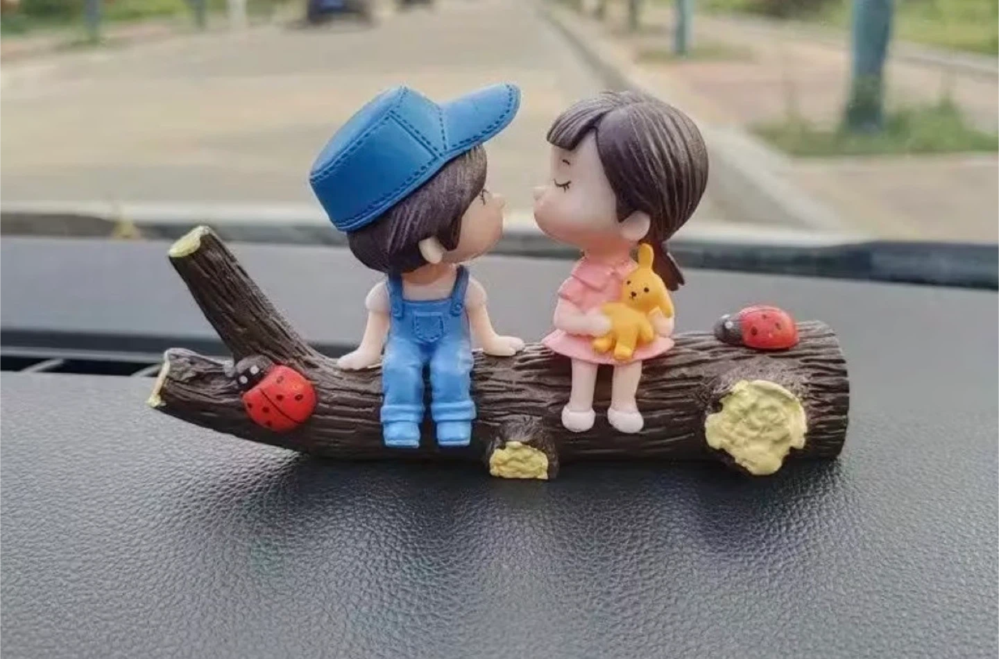Couple on Log Figurine