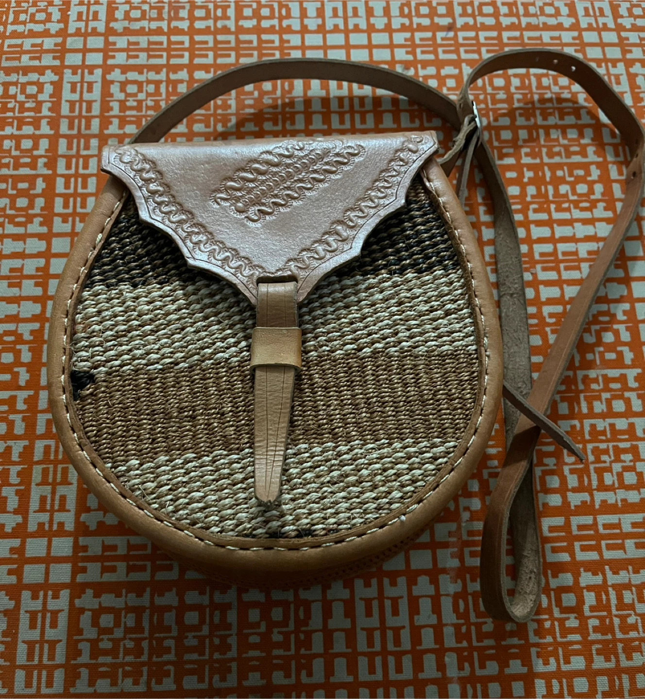 Leather and woven cross-body bag