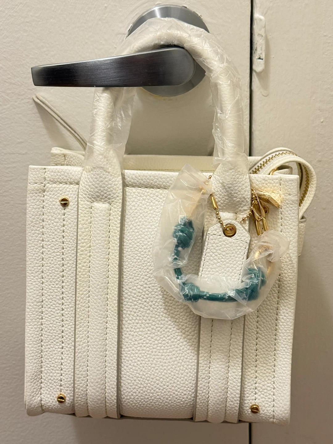 White pebbled leather mini tote bag