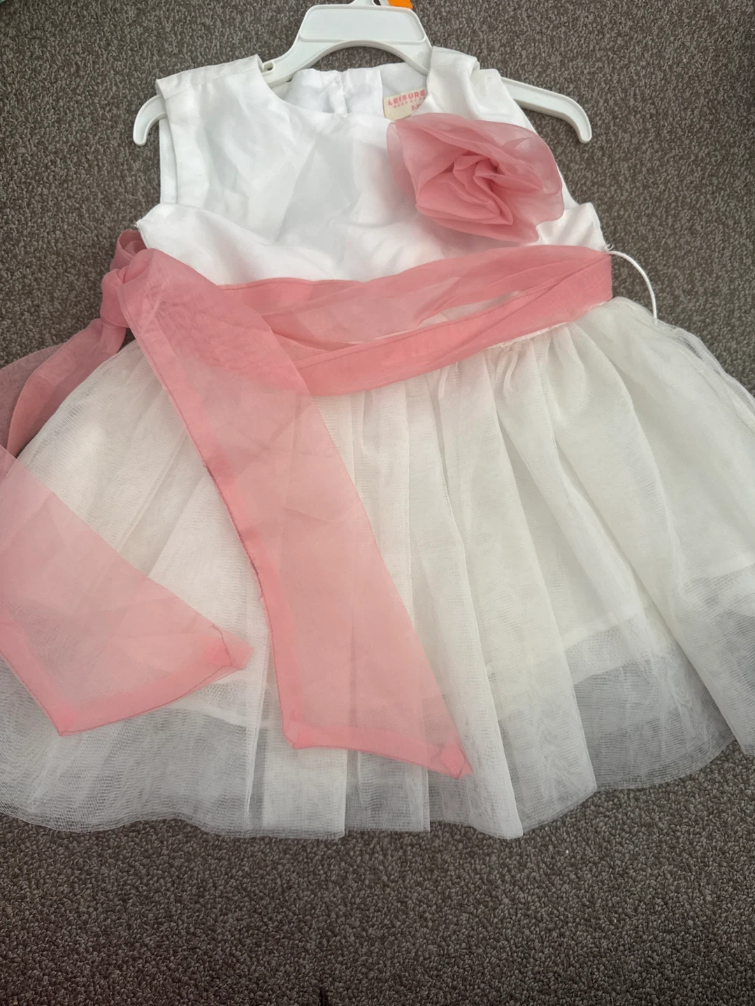 White Dress with Pink Sash and Flower Accent