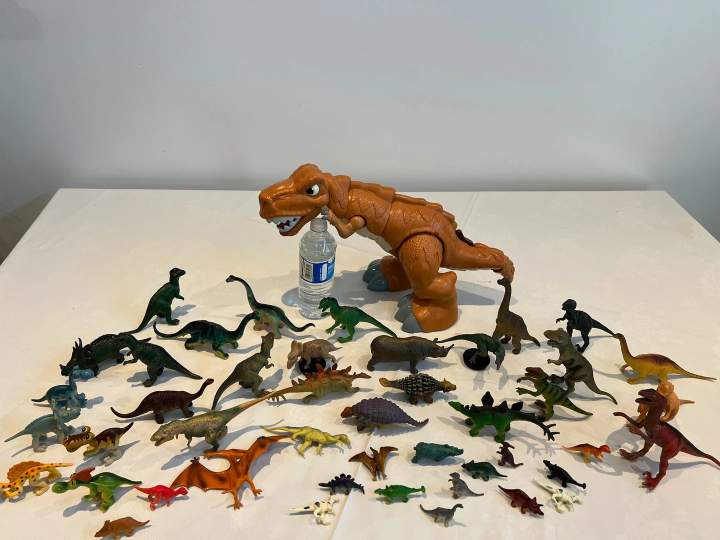 Large collection of plastic dinosaur toys