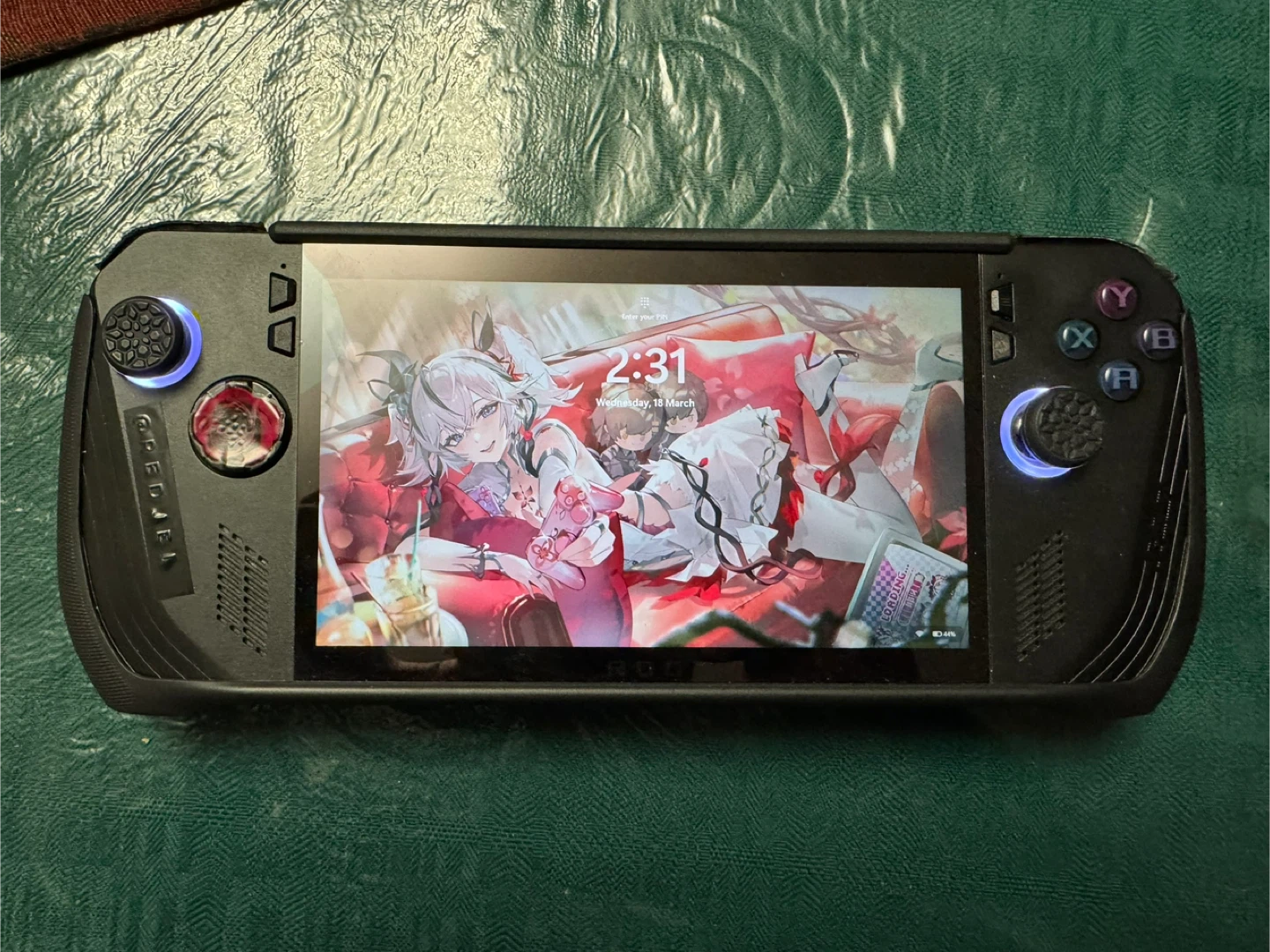 ASUS ROG ALLY X with accessories.