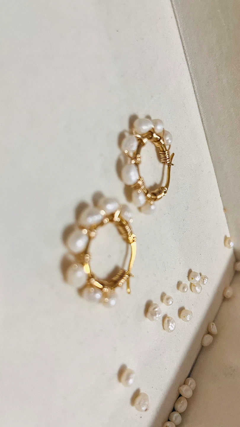 Gold tone hoop earrings with pearls and blue beads