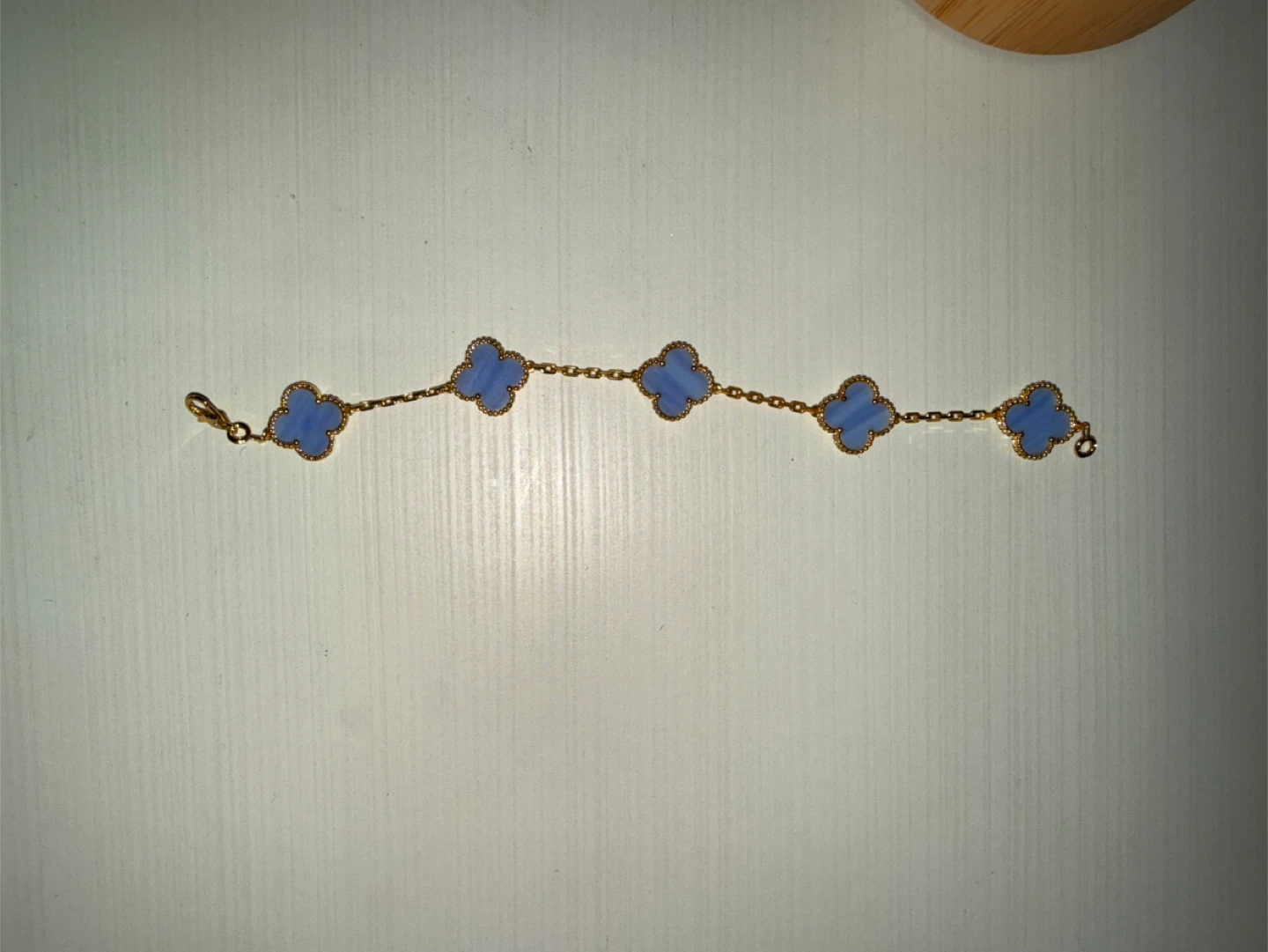 Gold-tone Bracelet with Blue Clover Charms