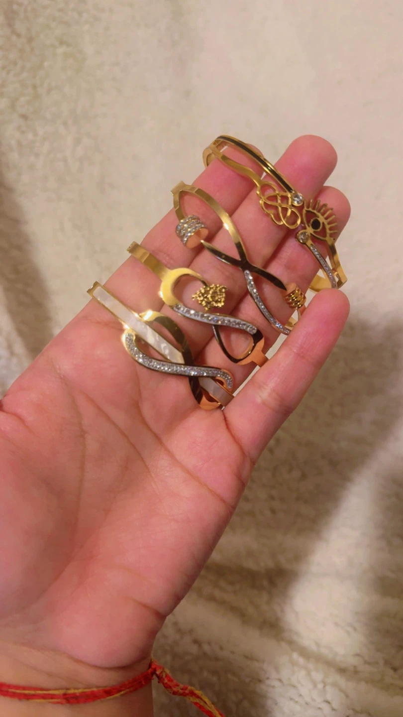 INFINITY BRACELETSSet of 4 Gold Tone Bracelets with Rhinestones