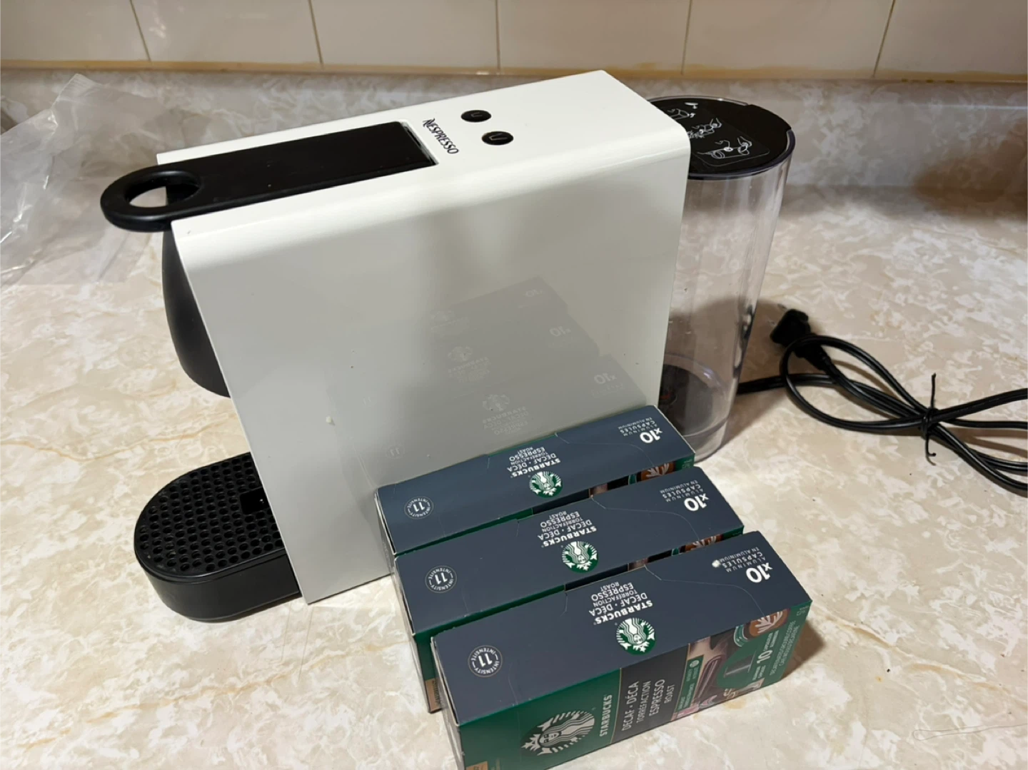 Nesspresso espresso machine with coffee pods Starbucks