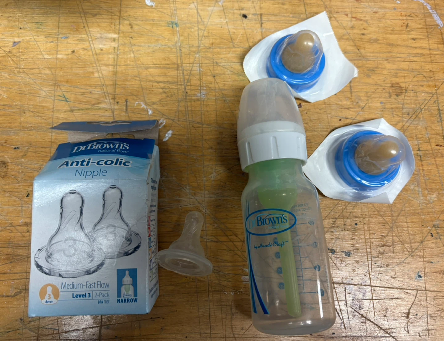 Assortment of baby bottles, plate, spoons, cactus toy - photo 2