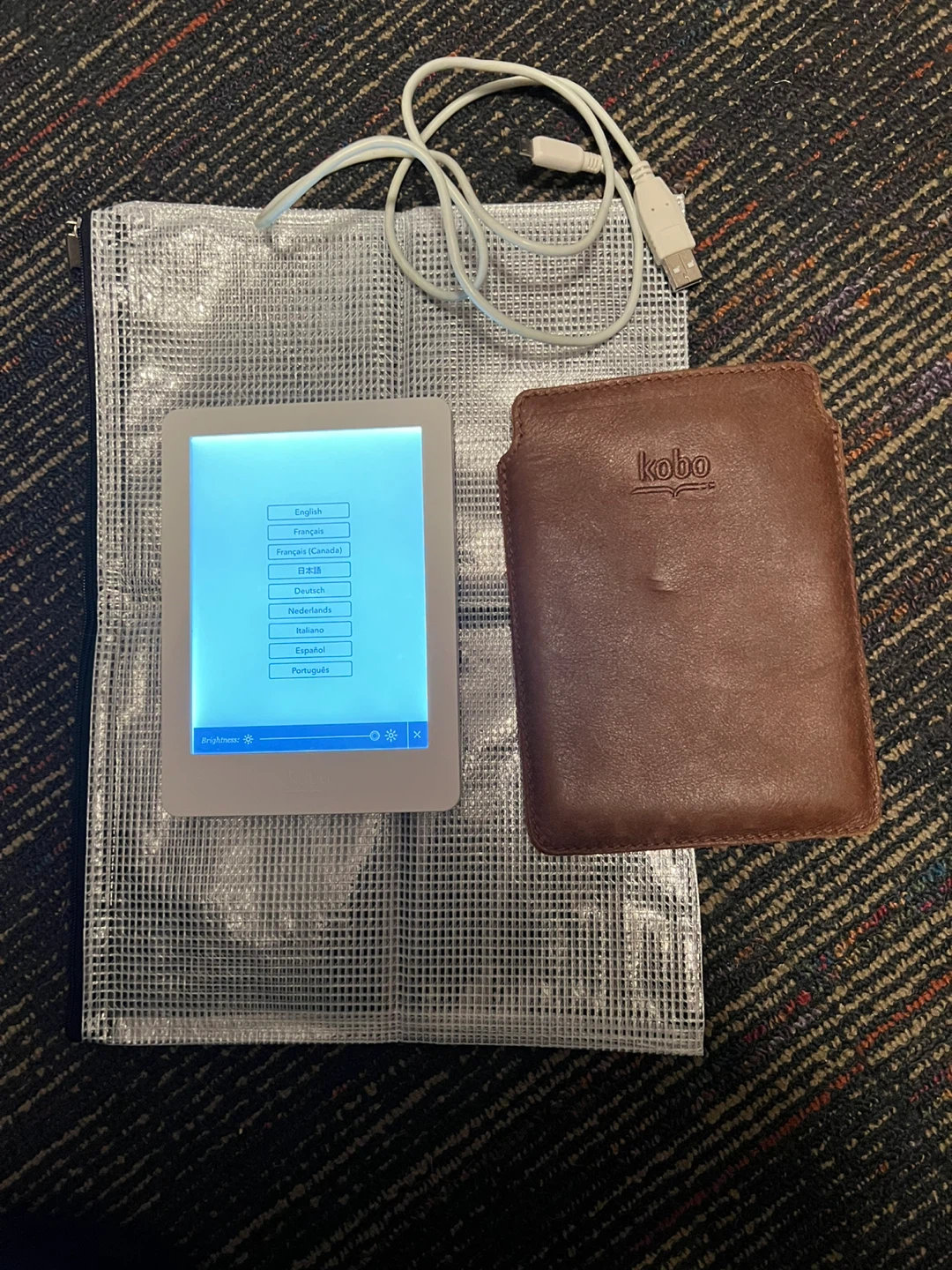 Kobo e-reader with leather case and sleeve