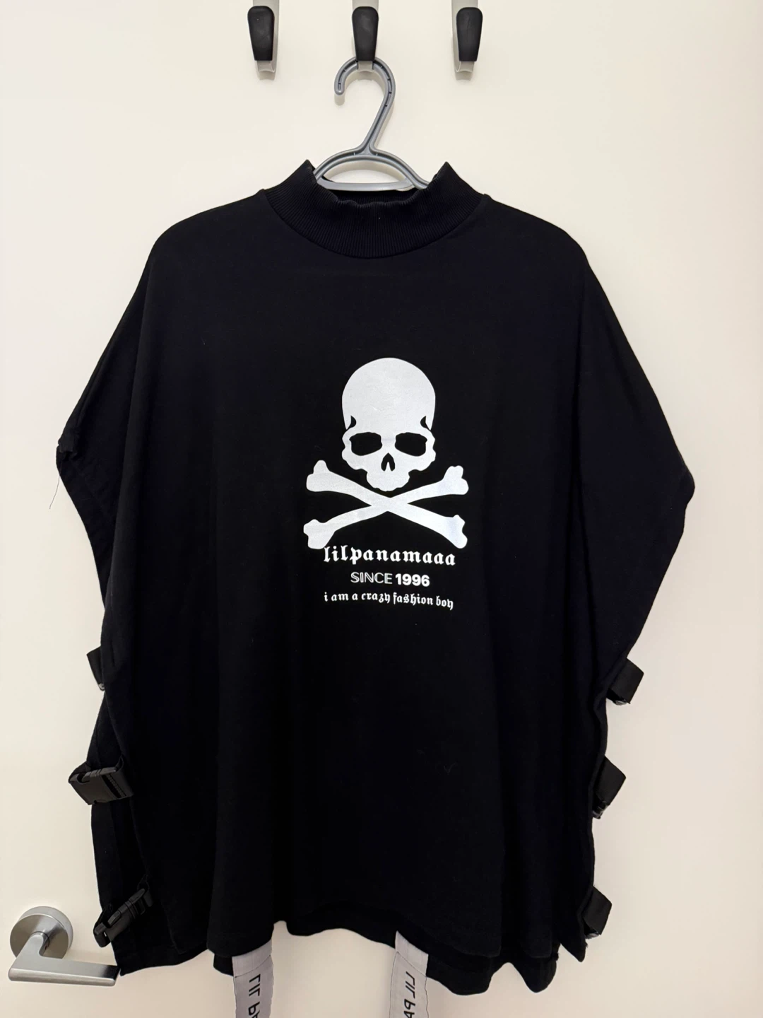 Black skull graphic open side top with buckle detail